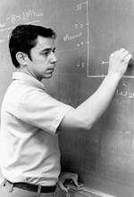 Dr. Edward Simco writing on a blackboard